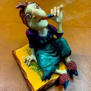 Vintage Kitchen Witch putting on lipStick